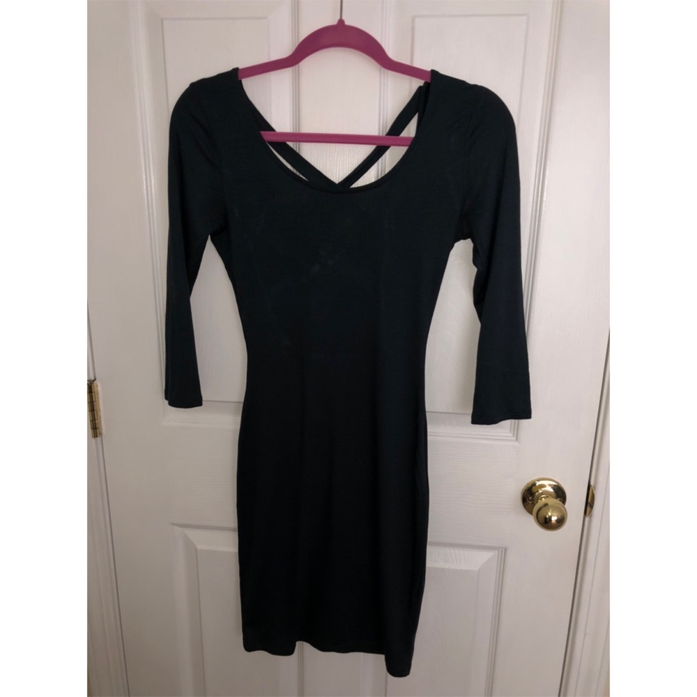 Long sleeve open back, tight fitting dress